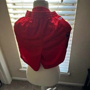 Boys red champion shorts with side logo. Size large. Good condition.